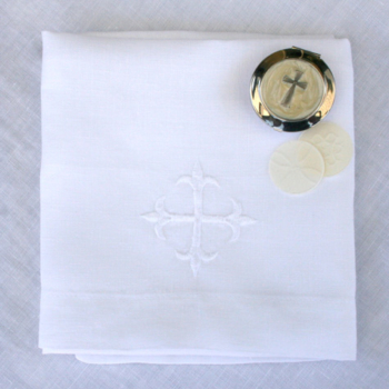 corporal linen with communion wafers and embroidered crossaltar linens